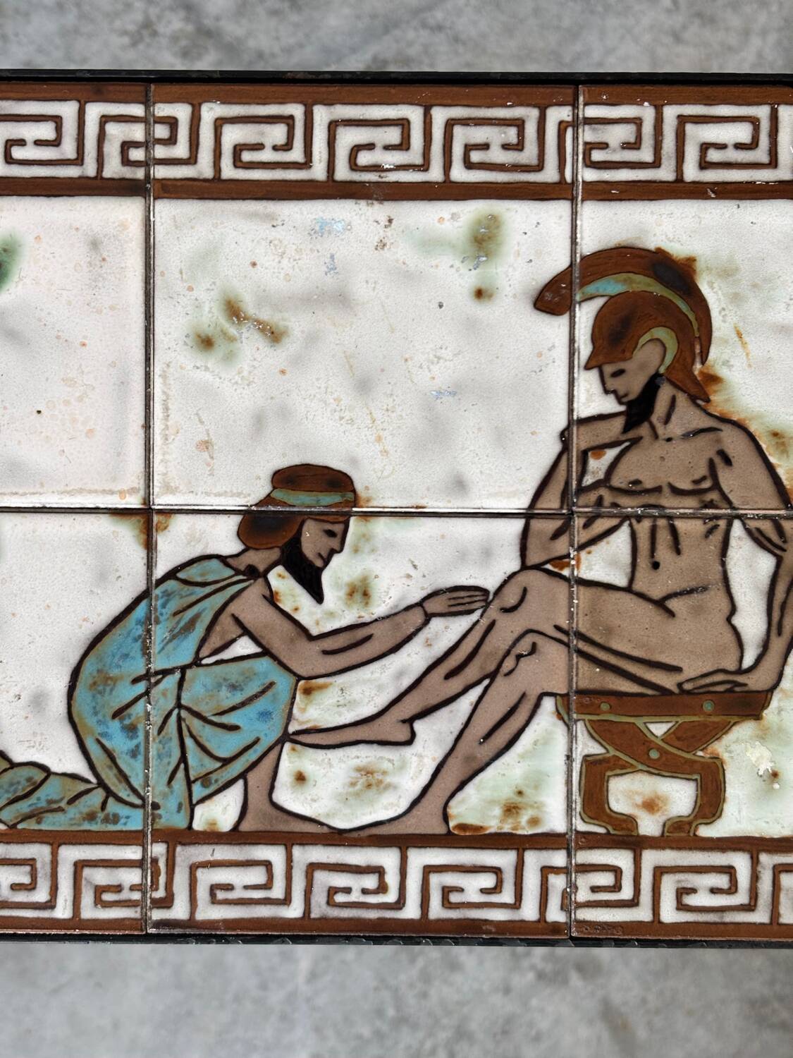 Vintage magazine table with Greek mythology motif.