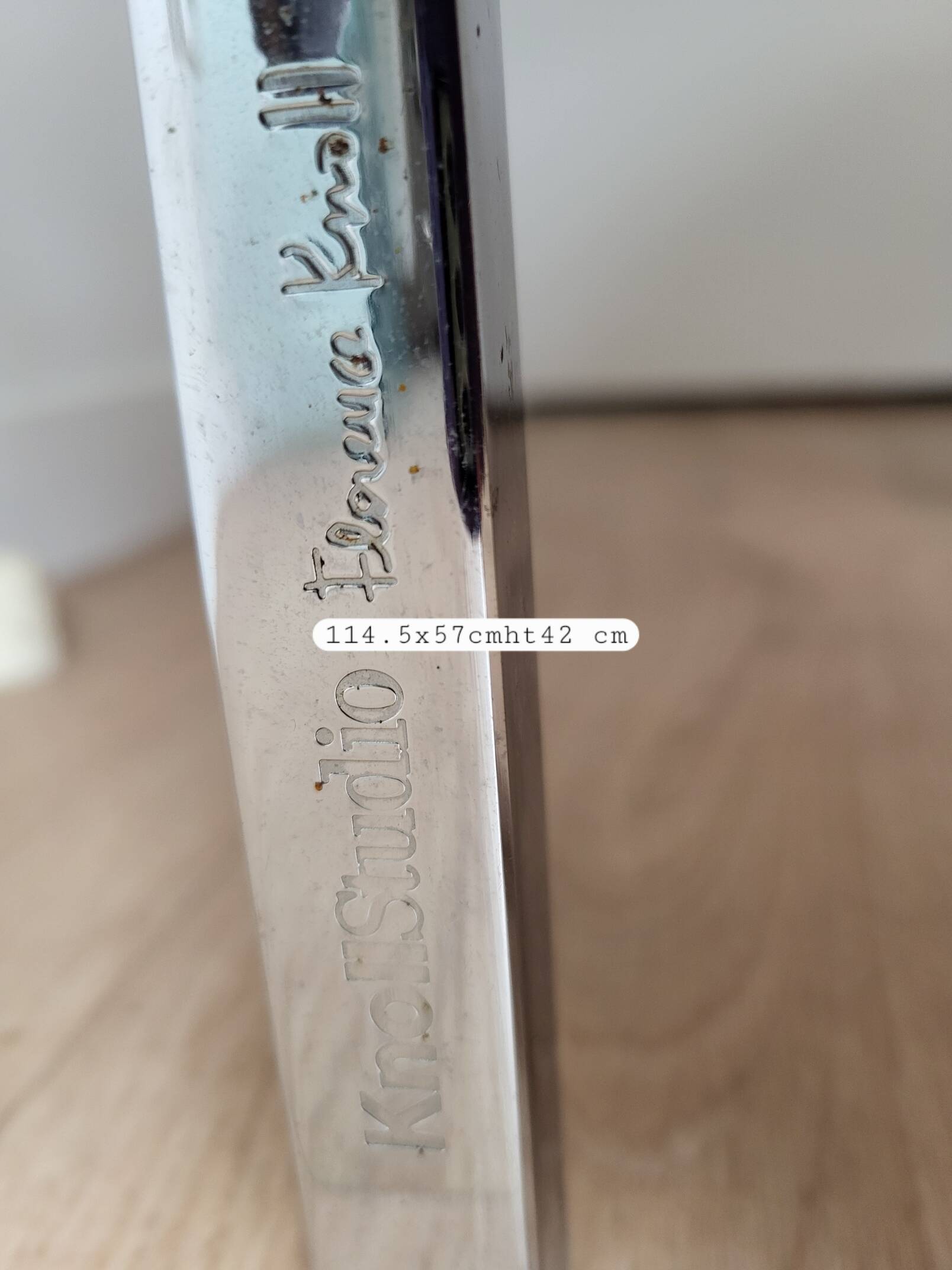 Knoll coffee table with smoked glass top and chrome metal.