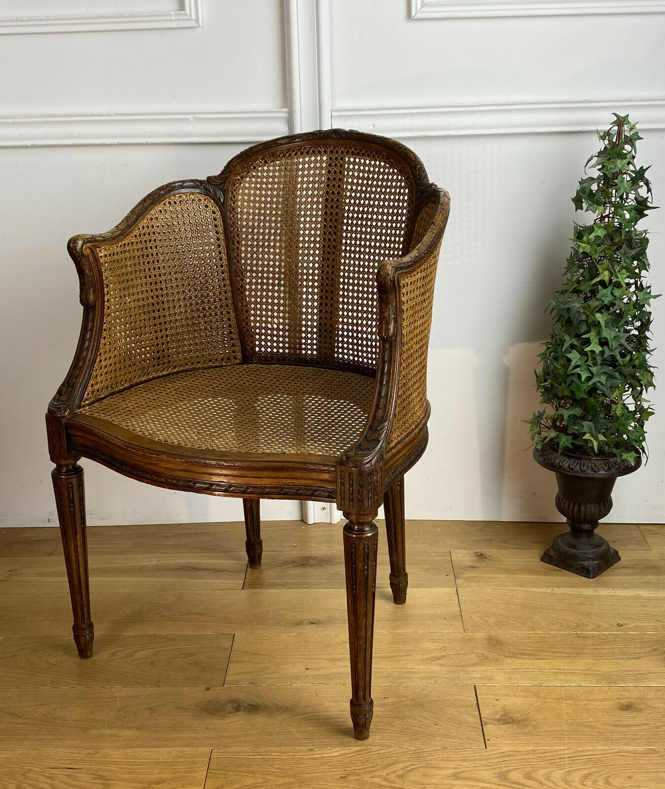 Old armchair with double cannage in walnut carved style Louis XVI of the nineteenth century