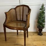 Old armchair with double cannage in walnut carved style Louis XVI of the nineteenth century