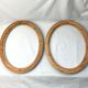 Pair of oval wooden frames with gilding