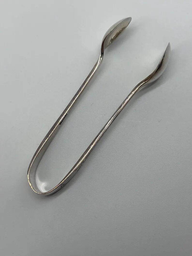 Service of 12 silver-plated metal coffee spoons with tongs and box from around 1900.