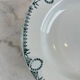 Set of 7 deep plates in earthenware, decorated with a green frieze.