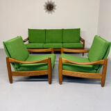 Living room sofa and Scandinavian design armchairs from the 1960s in green boucle.