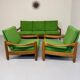 Living room sofa and Scandinavian design armchairs from the 1960s in green boucle.