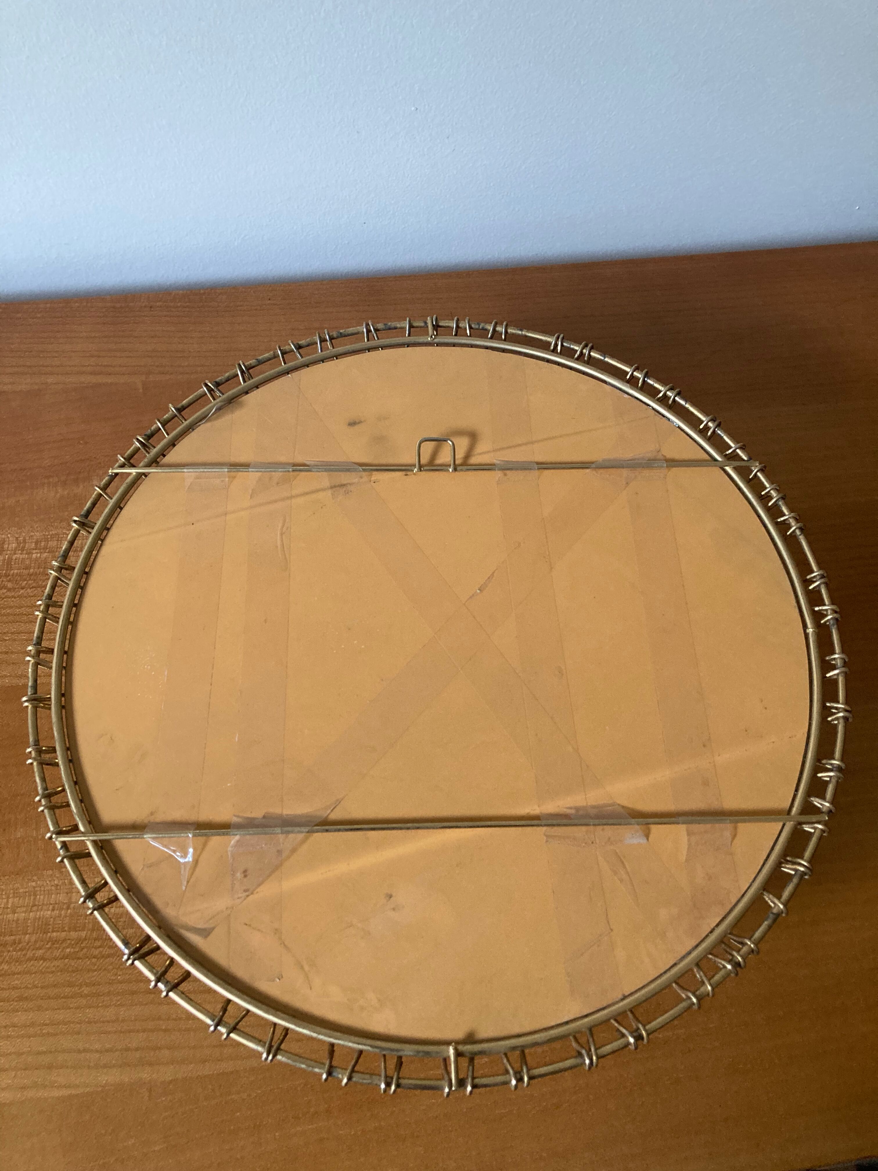 Sun mirror in gilded metal