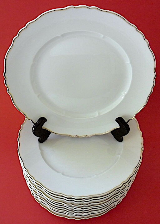 Suite of twelve table plates in white porcelain, golden lip
