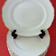 Suite of twelve table plates in white porcelain, golden lip