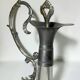 Vintage glass decanter with cut design and silver-plated metal, stopper included.