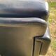Pair of black imitation leather armchairs