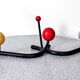 Vintage metal and wood coat rack in yellow/red/green.