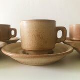 Stoneware coffee cups with saucers