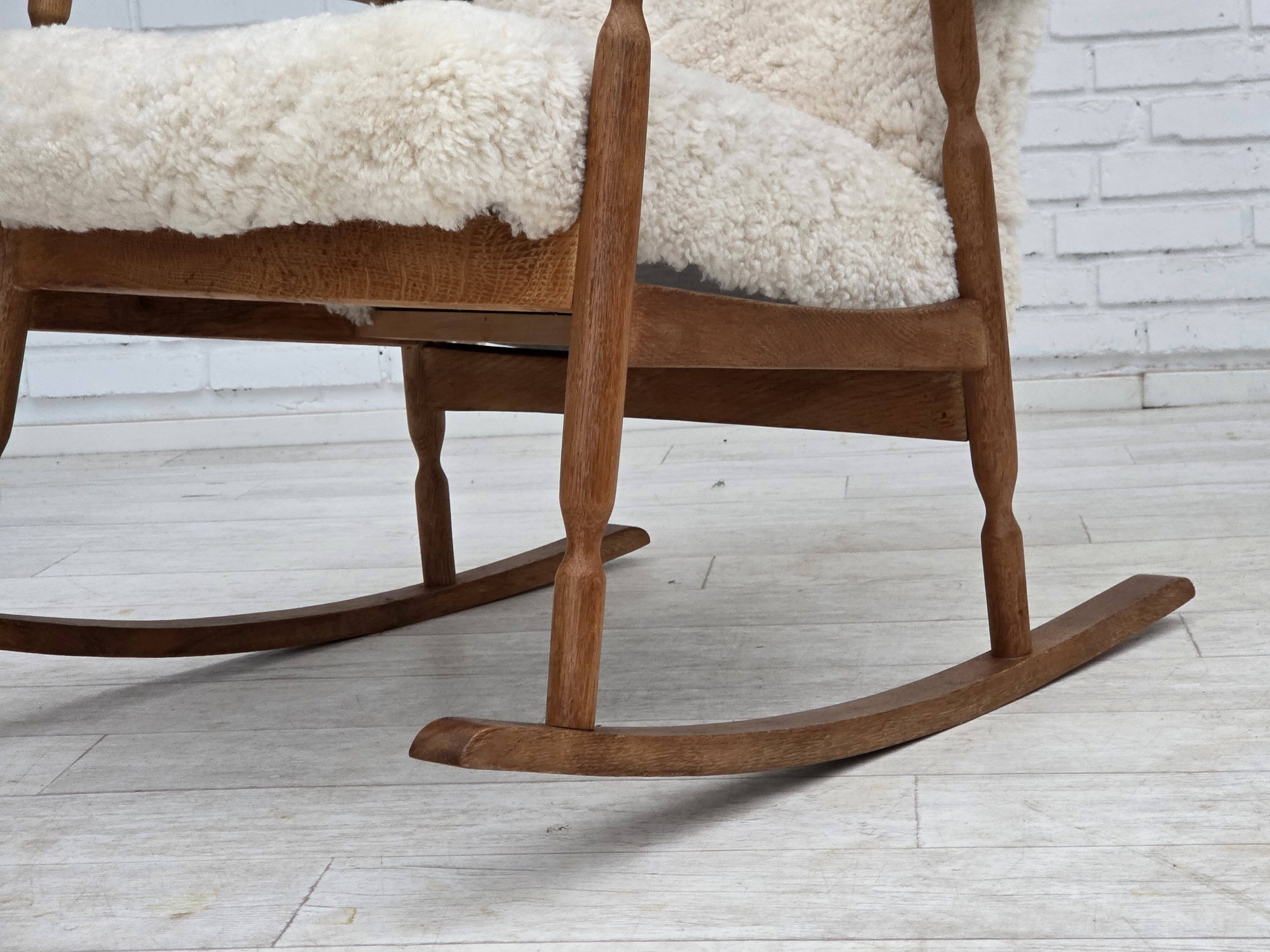 1970s, Danish rocking chair, reupholstered in quality genuine sheepskin.