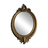 Antique oval mirror in Louis XV style, gilded with a matte rocaille finish, made of stucco.
