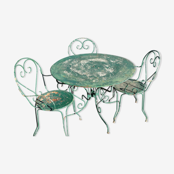 Table de jardin, deux fauteuils et une chaise en métal