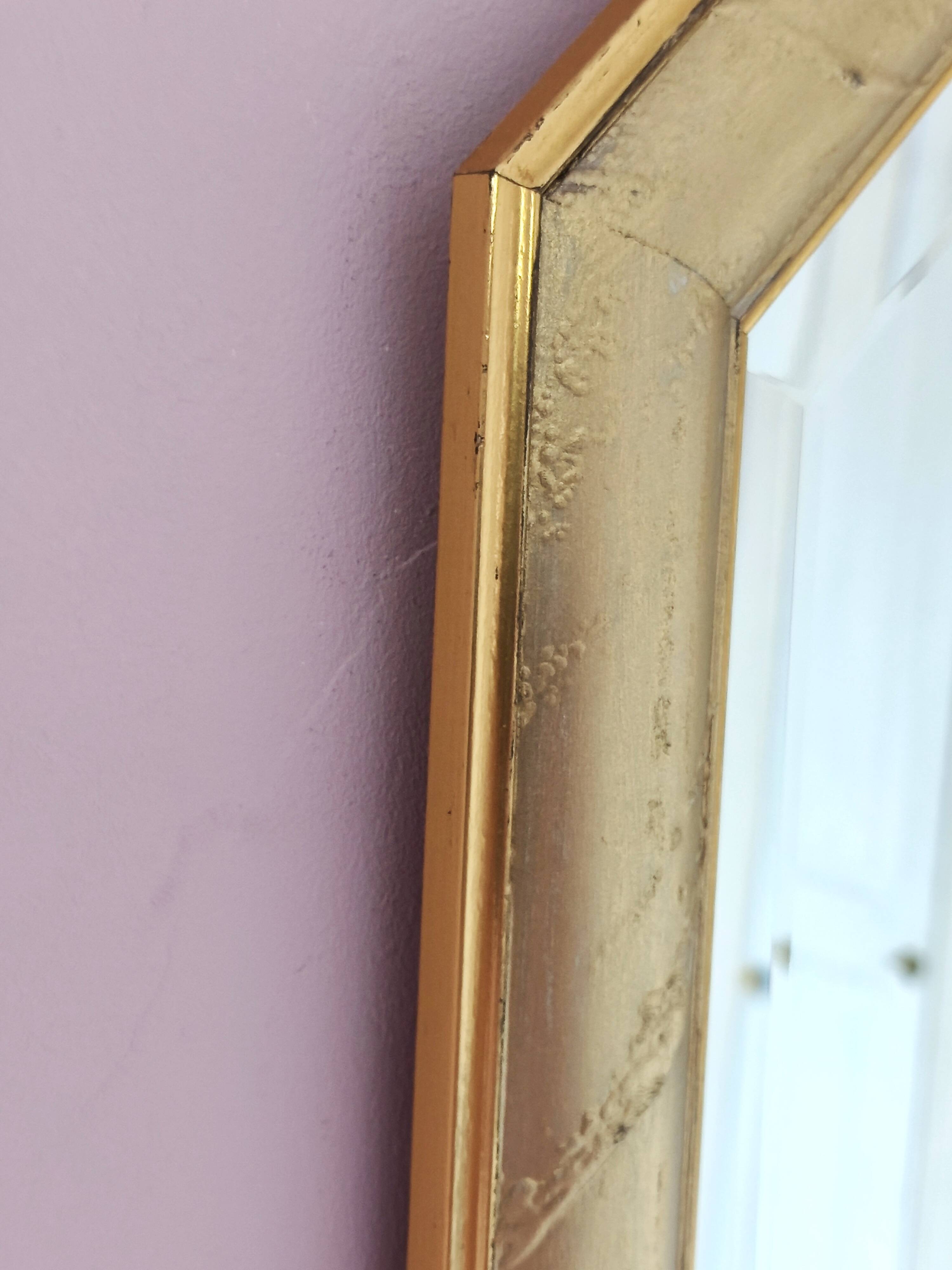 Golden octagonal mirror with bevelled glass from the 1970s.