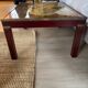 Table basse bois et laiton avec planisphère sous verre