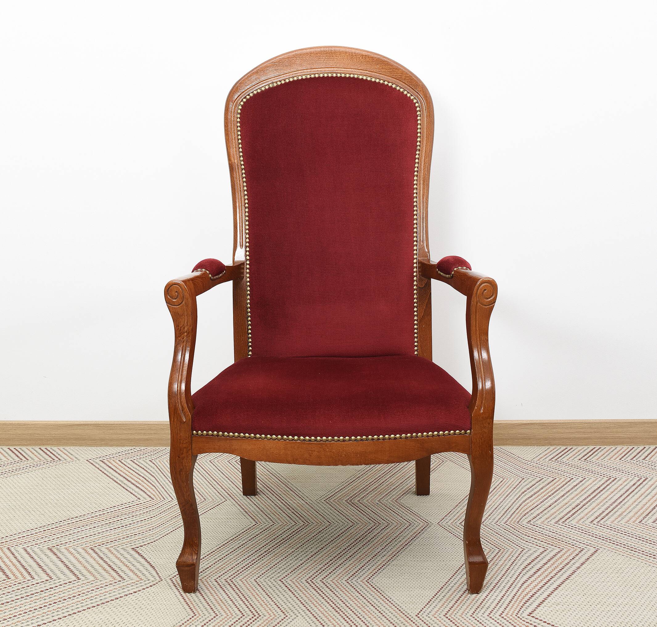 Burgundy Voltaire armchair