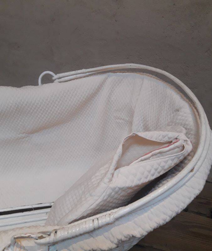 Wicker and painted wood baby cradle