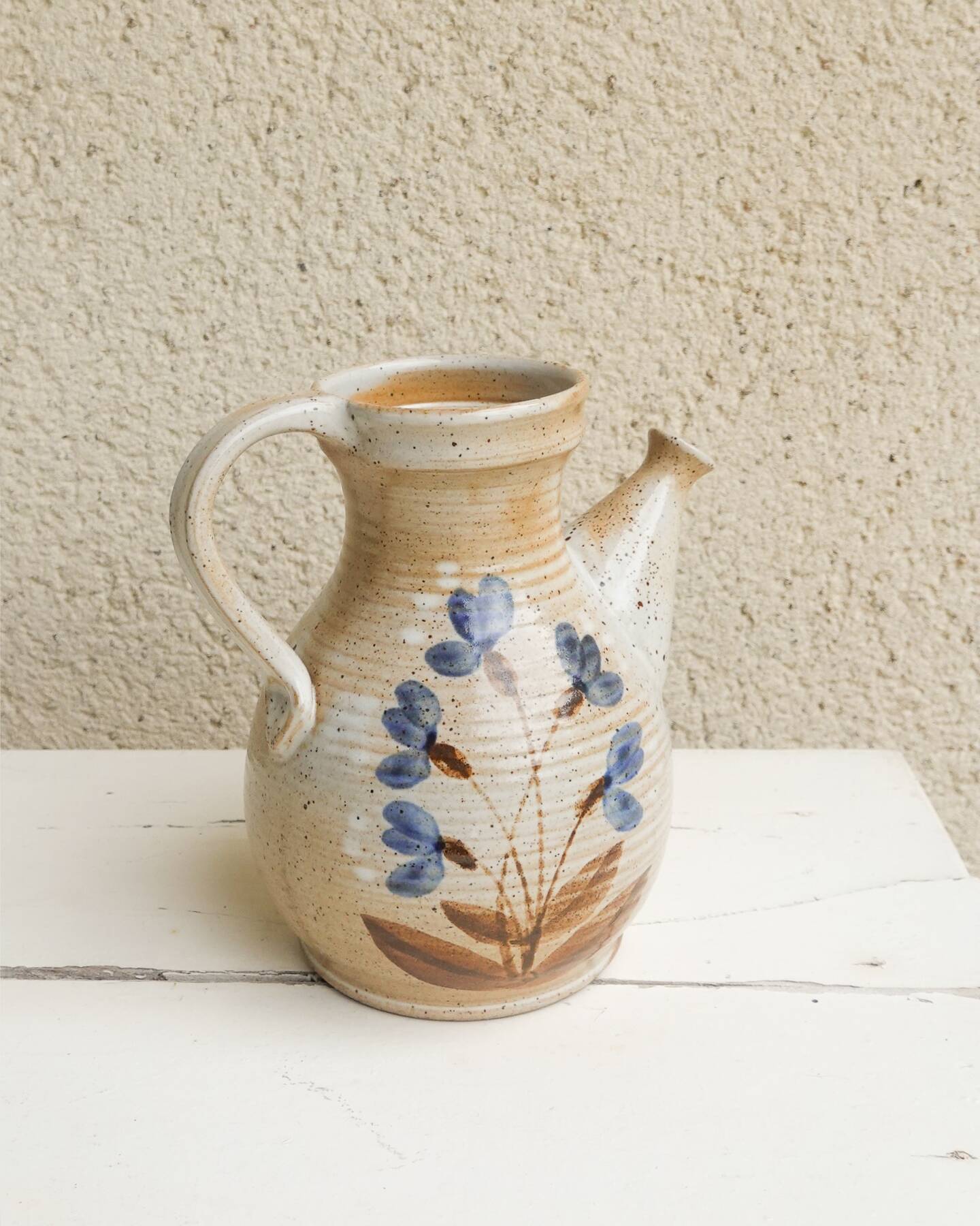 Marais stoneware pitcher, floral decoration