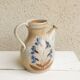 Marais stoneware pitcher, floral decoration