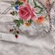 Embroidered tablecloth with its 12 napkins.