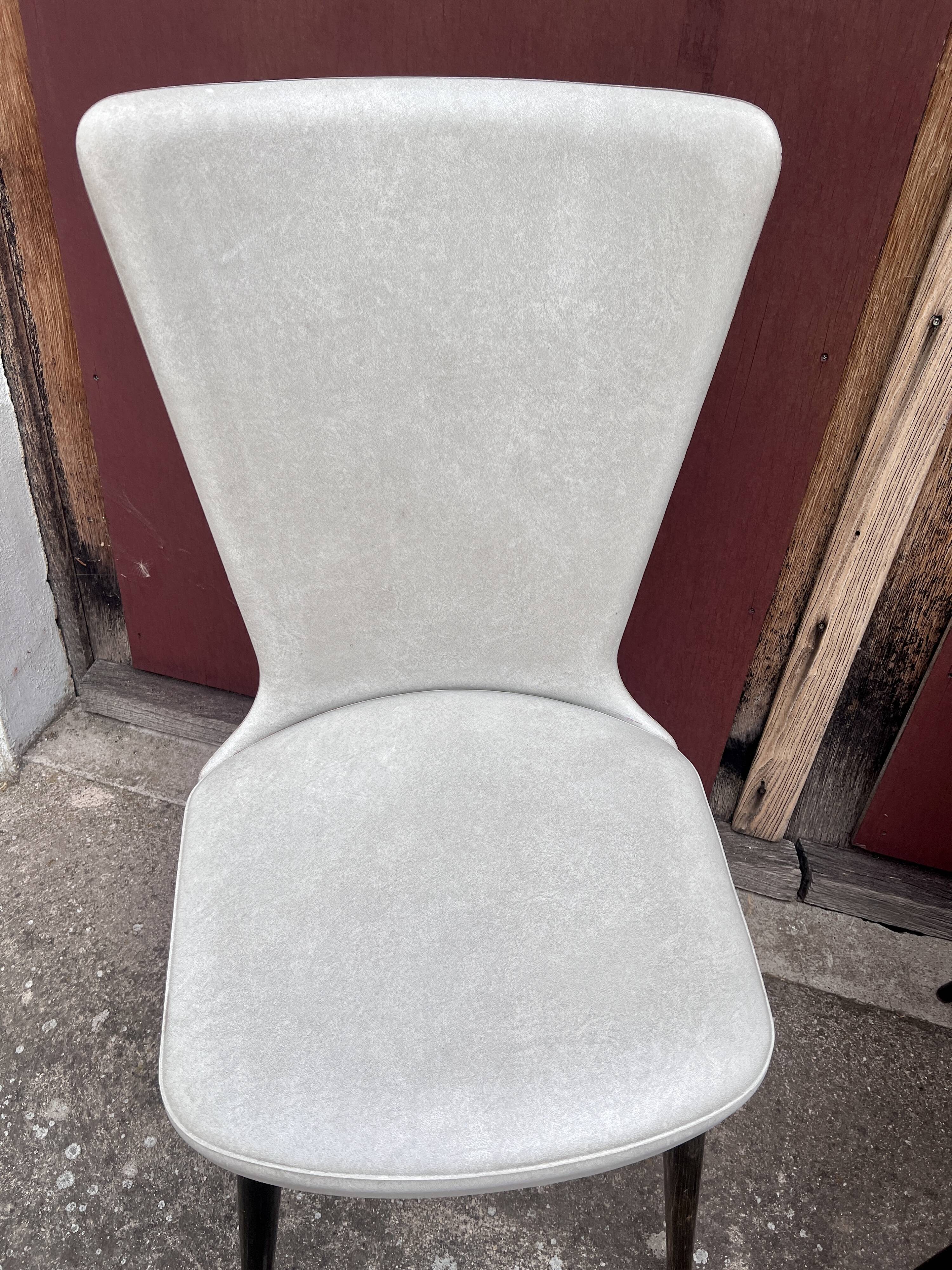 Pair of Chairs Baumann model Essor in imitation white leather, beech compass base