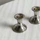 Pair of small light metal candlesticks