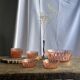 Service en verre rose vintage composé d'un saladier et de 8 coupelles
