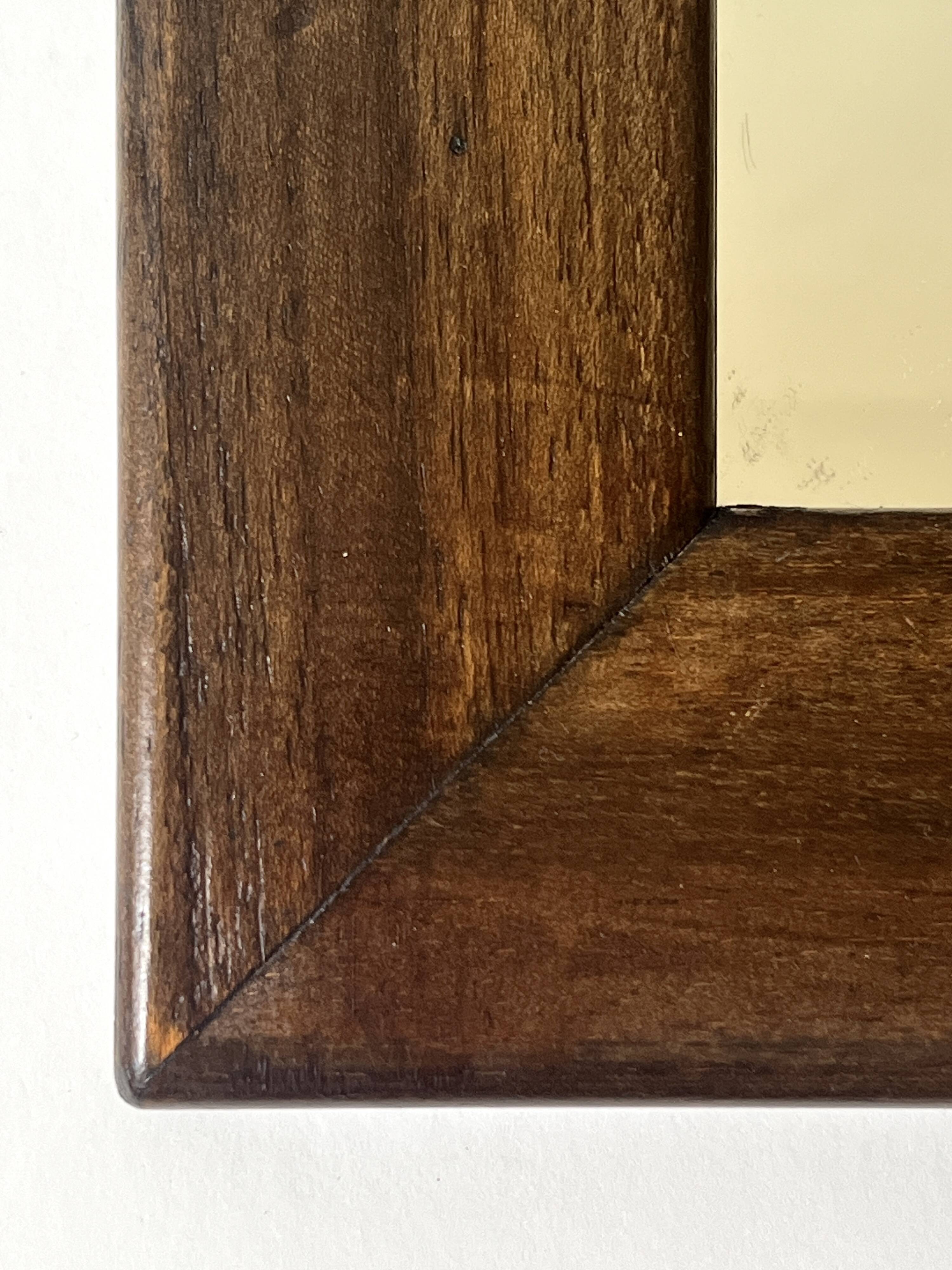 Brutalist rectangular wall mirror in solid wood, France 1950.