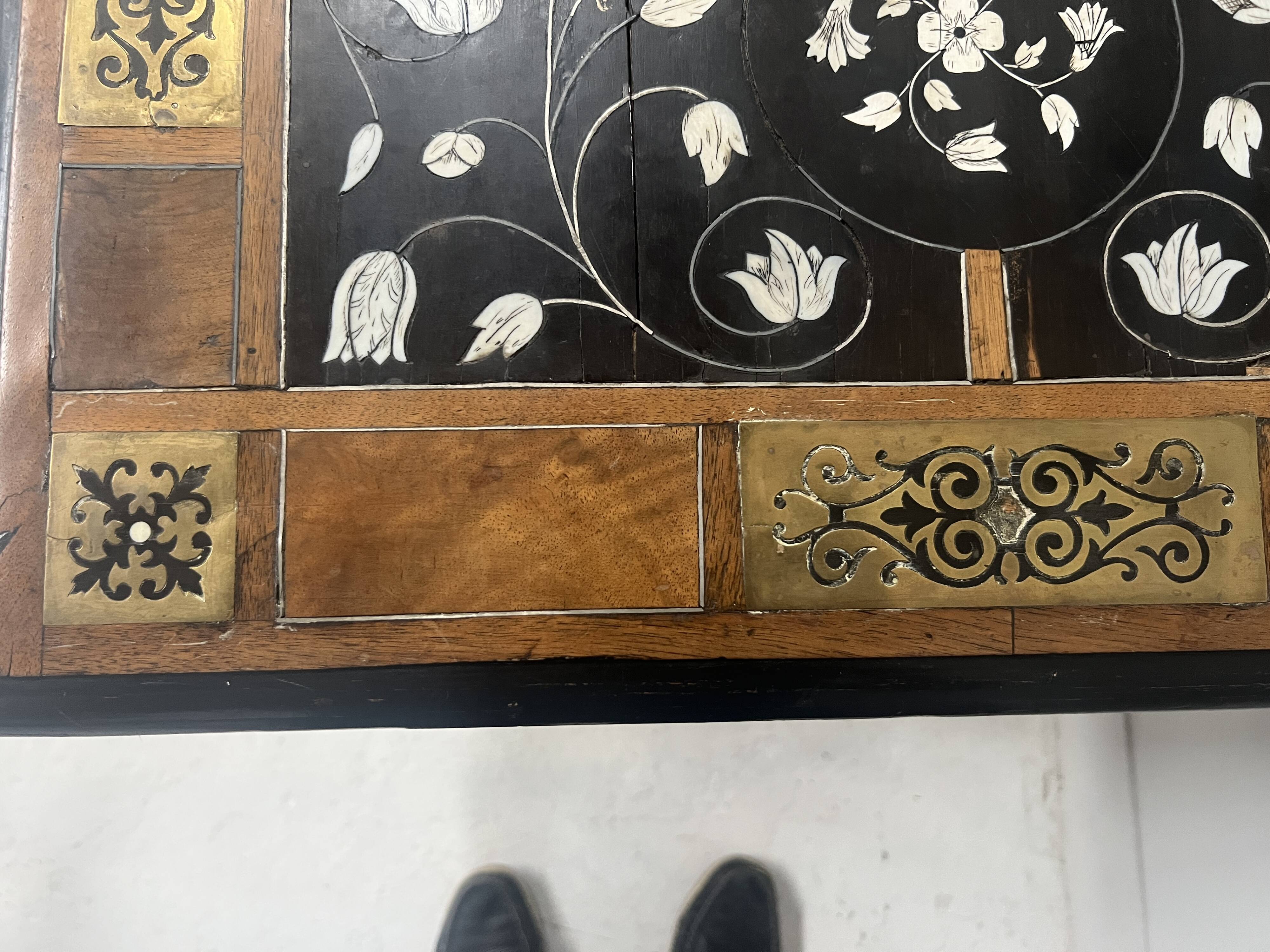 Blackened wood display table with marquetry top, Spain, 19th century.