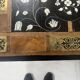 Blackened wood display table with marquetry top, Spain, 19th century.