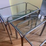 Nesting tables in chrome metal and white glass