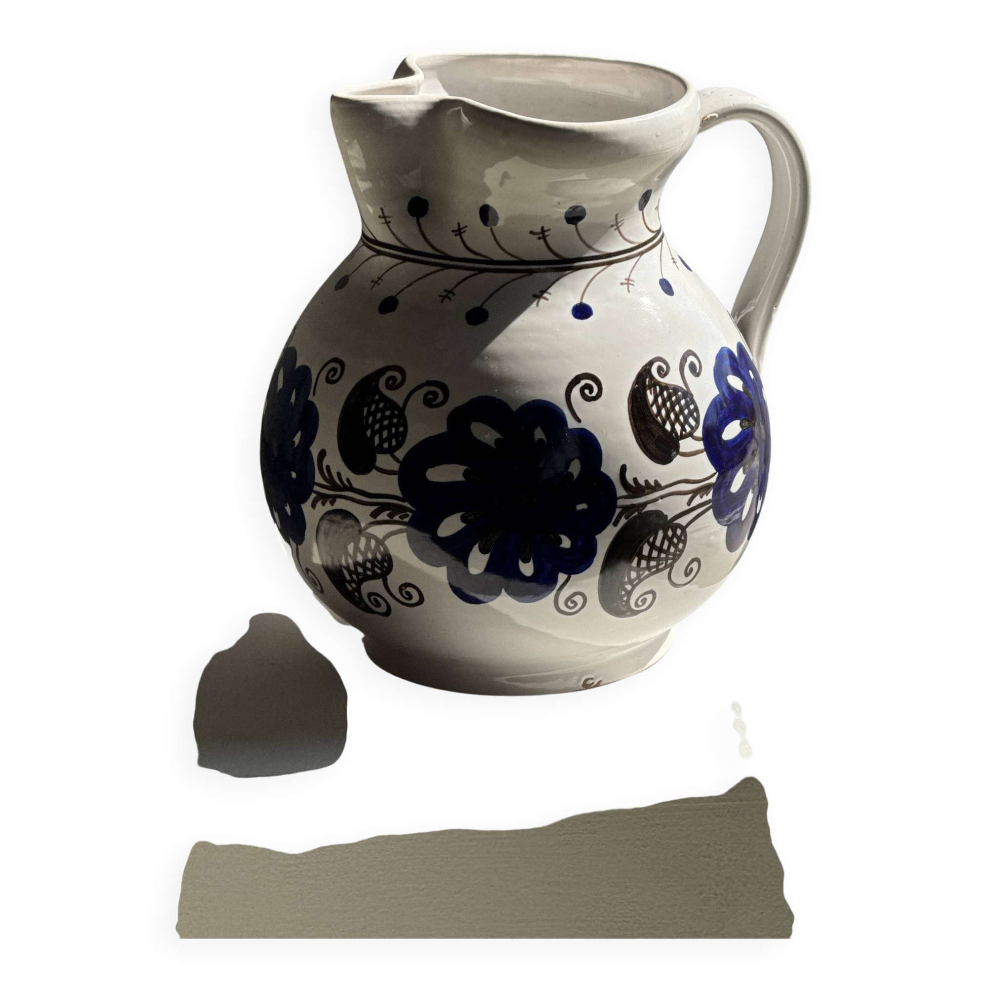 Very large vintage ceramic carafe in white glazed with blue floral decoration.