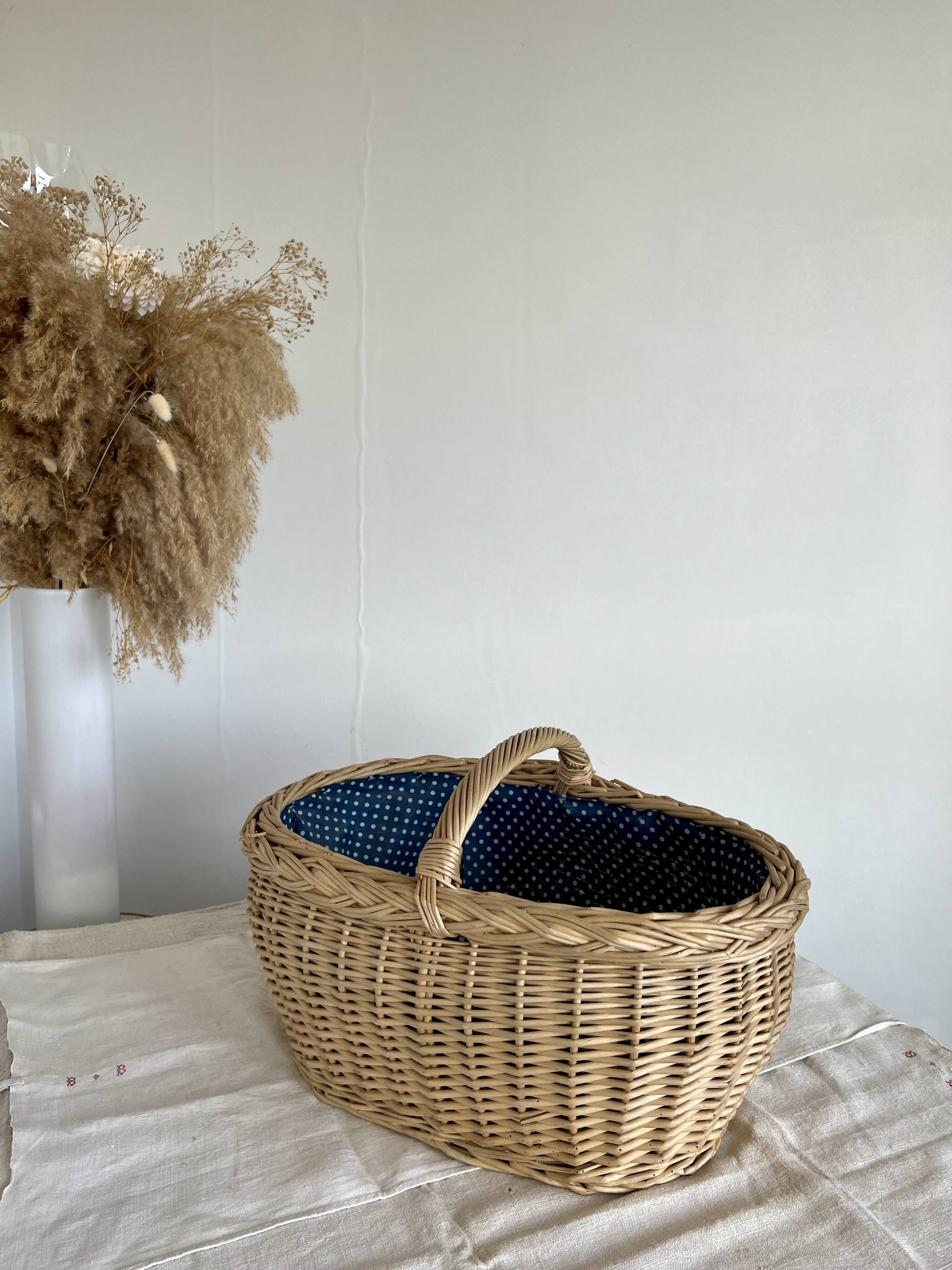 Large vintage wicker basket and blue lining with white polka dots