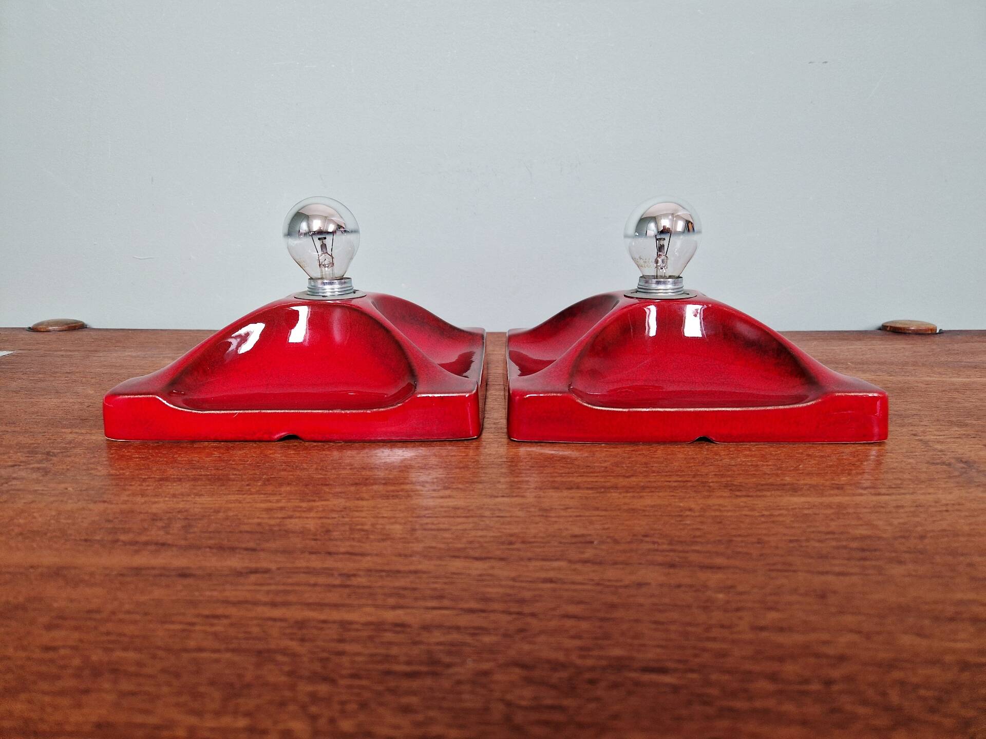 Pair of Space Age wall sconces in red ceramic, 1970.