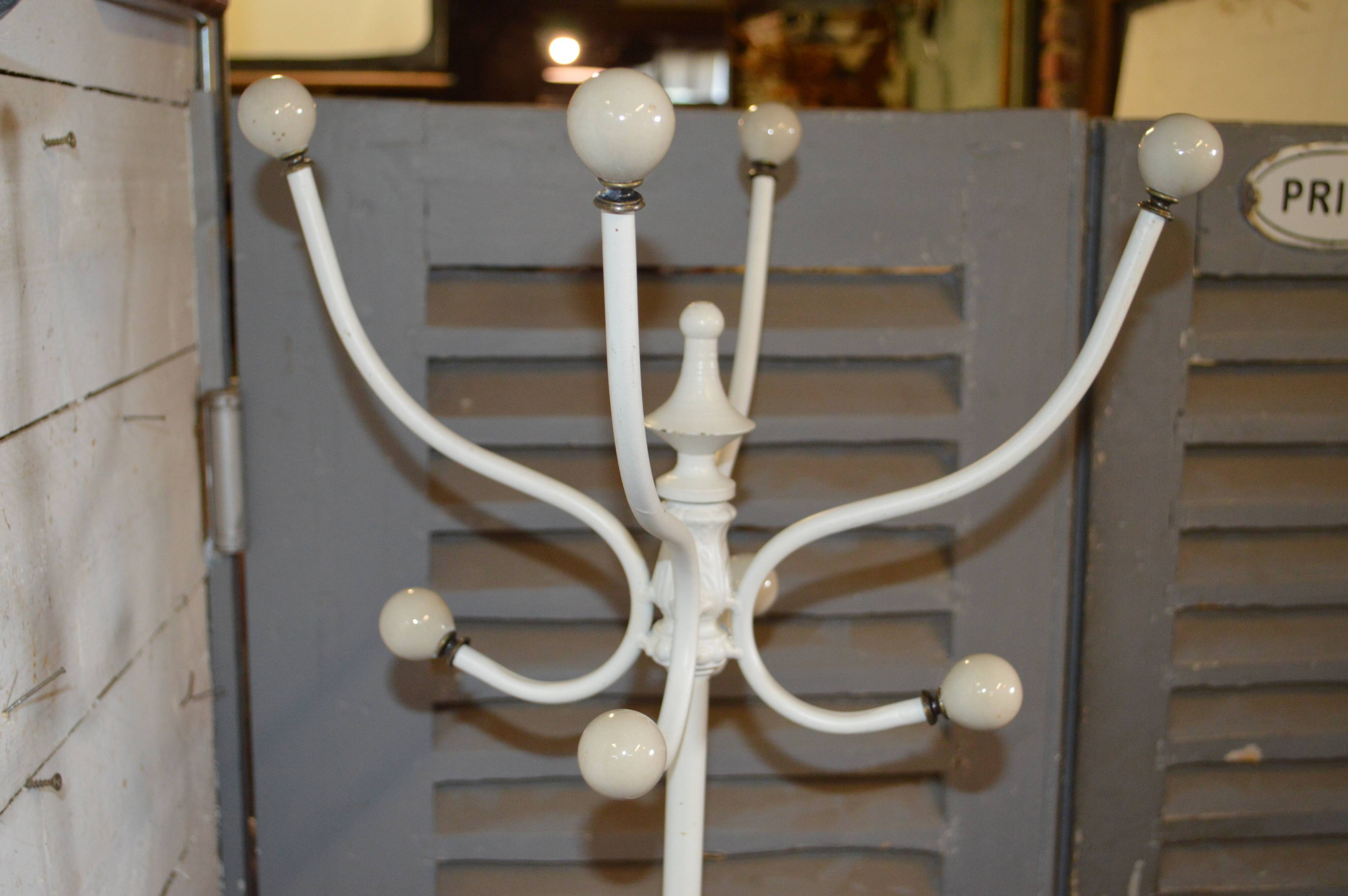 White patinated iron rotary coat holder