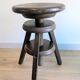 Antique wooden watchmaker's stool with screws, patinated wood.