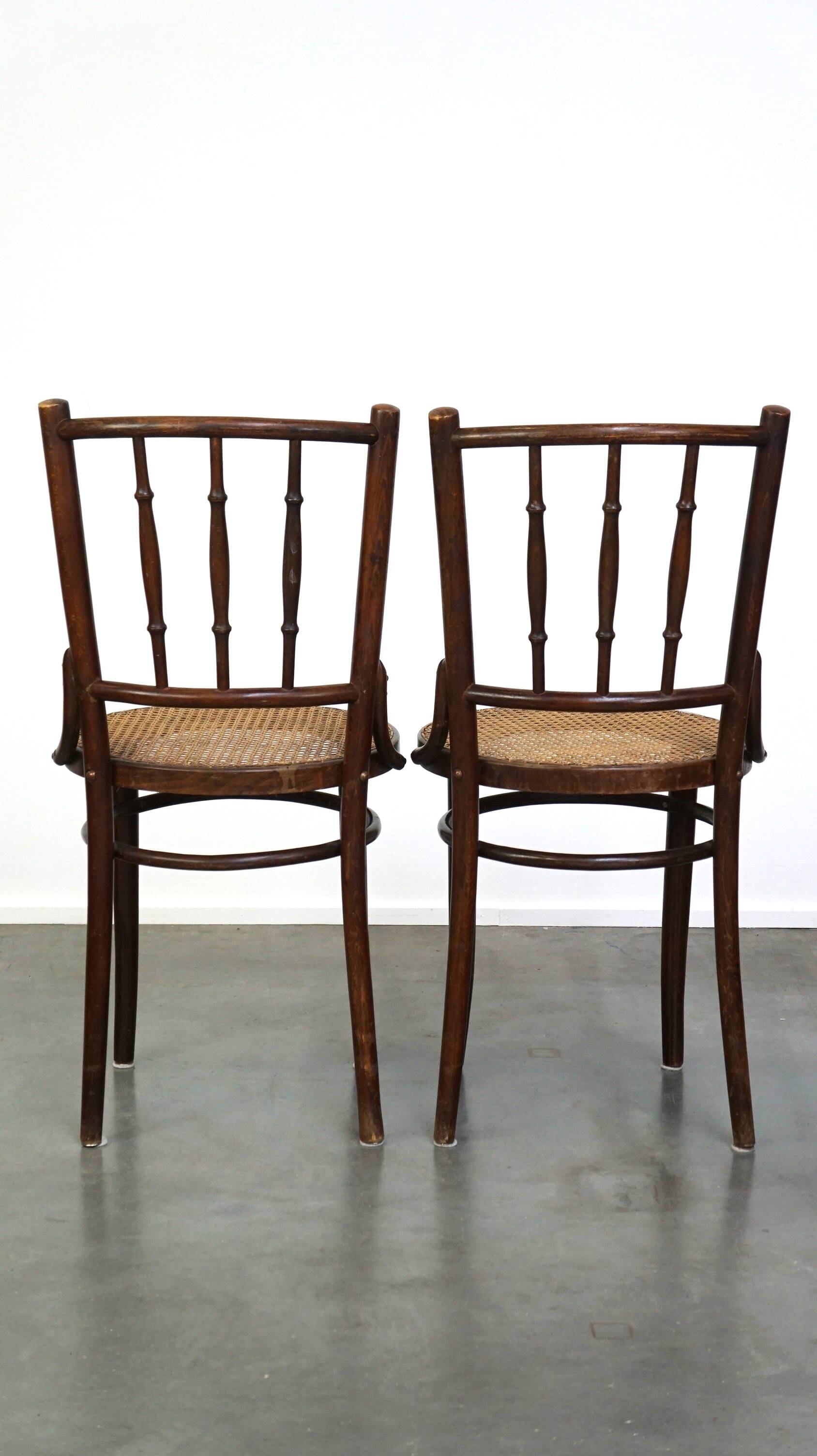 4 antique wooden and cane bistro chairs