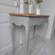 Console, side desk of beautiful craftsmanship re-enchanted in verdigris