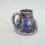 Pichet en céramique à émail violet bleu signé