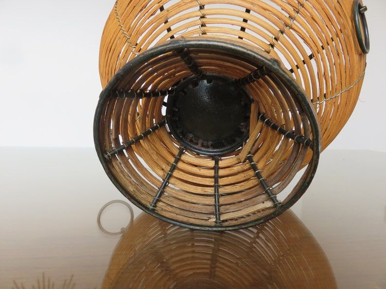 Standing fruit basket in rattan and black lacquered metal 1970