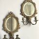 Pair of mirror sconces with bronze candlesticks from the 19th century.