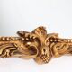 Highly decorated gilted carved wooden wall mirror, Belgium ca. 1950