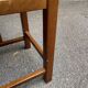 Square stool in solid wood with straw