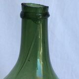 Former "lady jeanne" in blown glass, green bottle