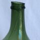 Ancienne “dame jeanne” en verre soufflé,vert bouteille