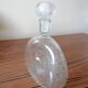 Clear bubble glass bottle molded for easy manual gripping
