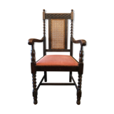 Carved wooden armchair and cannage