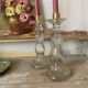 Paire de bougeoirs en verre flacons roger gallet